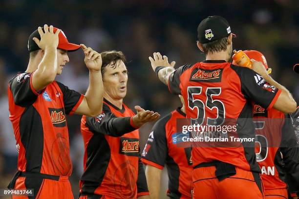 Brad Hogg of the Melbourne Renegades celebrates the wicket of Ashton Agar of the Perth Scorchers during the Big Bash League match between the...