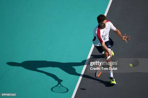 Pablo Carreno Busta of Spain plays a forehand during his 5th place play-off match against Andrey Rublev of Russia on day two of the Mubadala World...