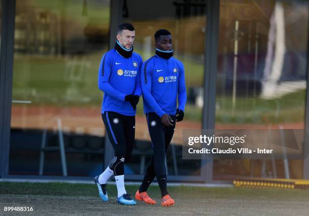 Ivan Perisic and Yann Karamoh of FC Internazionale chat during the FC Internazionale training session at Suning Training Center at Appiano Gentile on...