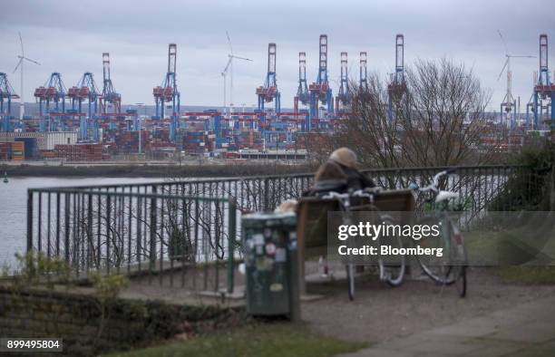 Containers and cranes stand at the Hamburger Hafen und Logistik AG Container Terminal Burchardkai in the Port of Hamburg in Hamburg, Germany, on...