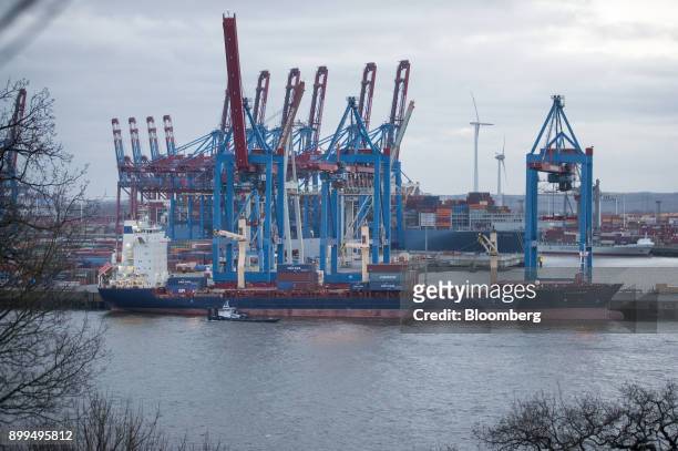 Containers are loaded onto the Vladimir container shipping vessel at the Hamburger Hafen und Logistik AG Container Terminal Burchardkai in the Port...