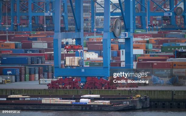 Containers and cranes stand at the Hamburger Hafen und Logistik AG Container Terminal Burchardkai in the Port of Hamburg in Hamburg, Germany, on...