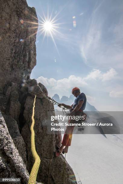 man rock climbing at surfs up in bugaboo mountains, british columbia, canada - snowpatch spire stock pictures, royalty-free photos & images