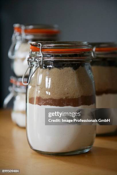 chocolate chip cookie and oatmeal raisin cookie mixes in preserving jars - raisin cookie stock pictures, royalty-free photos & images