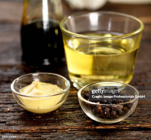dijon mustard, peppercorns, white wine vinegar and balsamic vinegar - white vinegar stock pictures, royalty-free photos & images