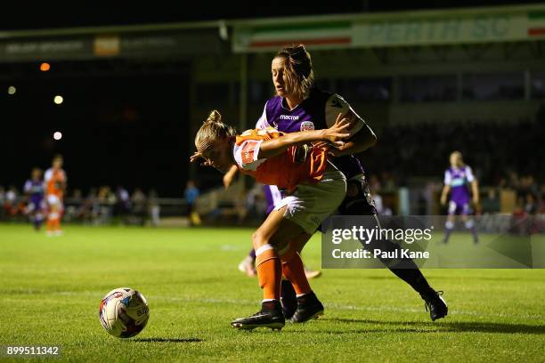 Tameka Butt of the Roar and Natasha Rigby of the Perth Glory contest for the ball during the round nine W-League match between the Perth Glory and...