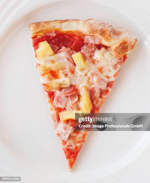a slice of pizza with ham and pineapple - hawaiian pizza stock pictures, royalty-free photos & images