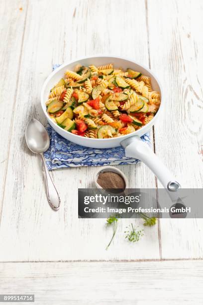 fusilli with courgettes, tomato and dill - zucchine stock pictures, royalty-free photos & images