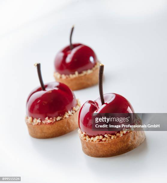 cherry ice cream tartlets - ice cream cake stock pictures, royalty-free photos & images