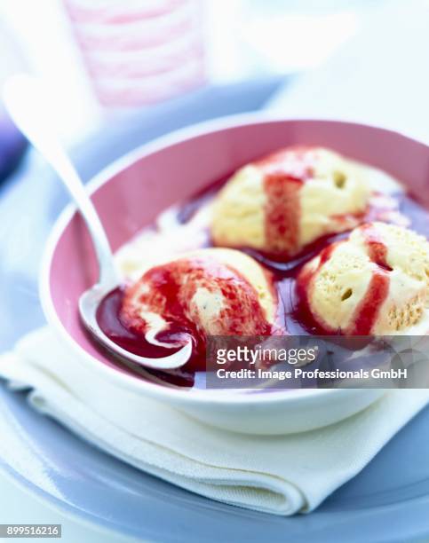 pistachio ice cream and summer fruit pure - coulis stock pictures, royalty-free photos & images
