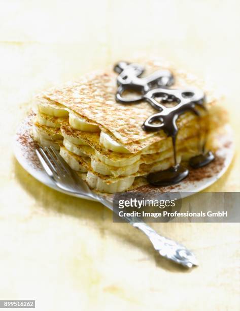 pancake,banana and chocolate mille-feuille - coulis stock pictures, royalty-free photos & images