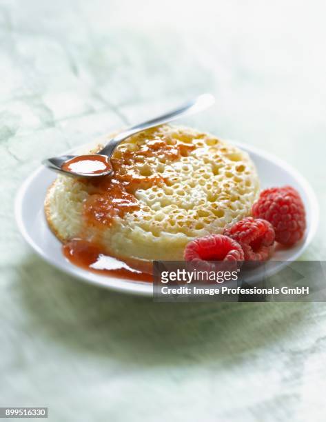 crumpet with raspberry syrup - raspberry coulis stock pictures, royalty-free photos & images
