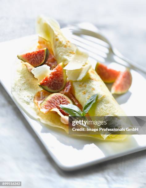 rolled pancake filled with figs,parmesan and pancetta - charcuterie fromage stock pictures, royalty-free photos & images