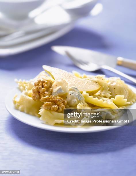 raviolis with gorgonzola,pear and walnuts - gorgonzola stock pictures, royalty-free photos & images