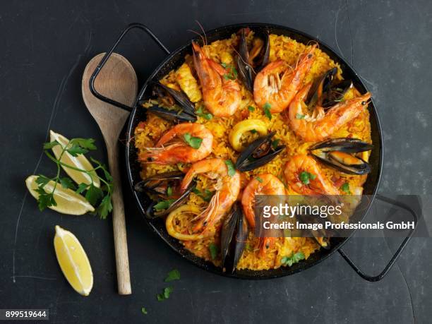 paella decorated with mussels and prawns - gambas ストックフォトと画像