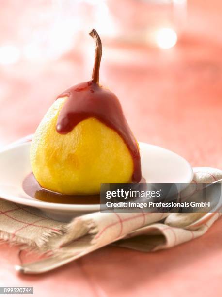poached pear with summer fruit puree - coulis stock pictures, royalty-free photos & images