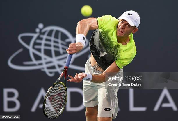 Kevin Anderson of South Africa serves during his semi-final match against Dominic Thiem of Austria on day two of the Mubadala World Tennis...