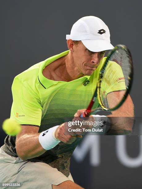 Kevin Anderson of South Africa plays a backhand during his semi-final match against Dominic Thiem of Austria on day two of the Mubadala World Tennis...