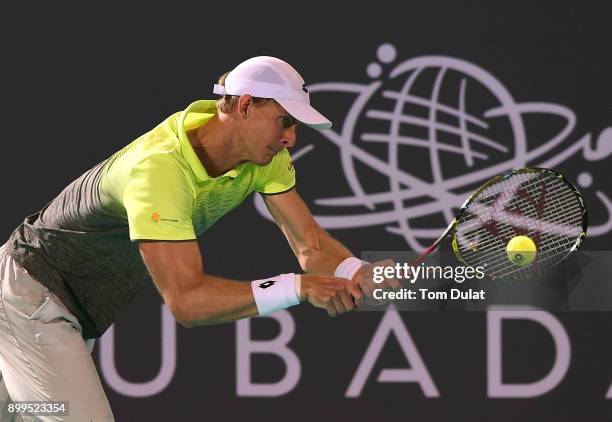 Kevin Anderson of South Africa plays a backhand during his semi-final match against Dominic Thiem of Austria on day two of the Mubadala World Tennis...