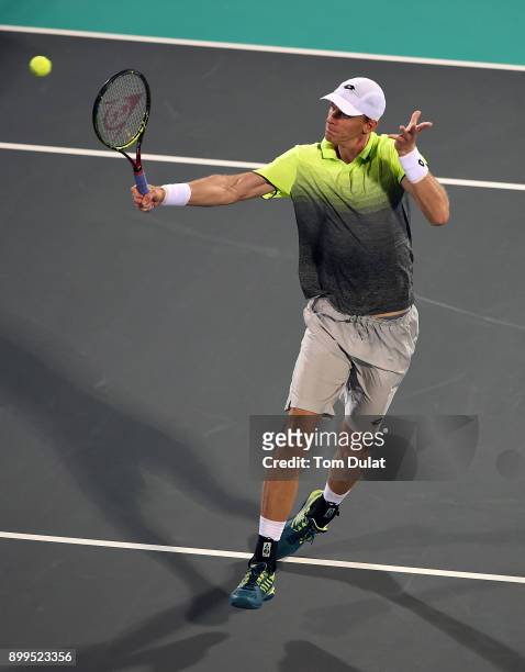 Kevin Anderson of South Africa plays a backhand during his semi-final match against Dominic Thiem of Austria on day two of the Mubadala World Tennis...