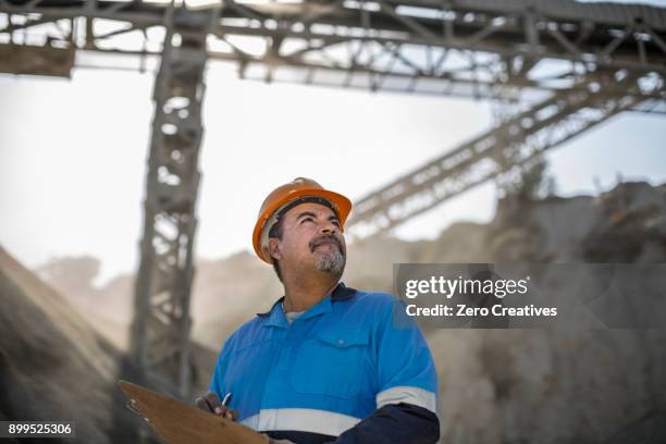 portrait of quarry worker in quarry - miners stock-fotos und bilder