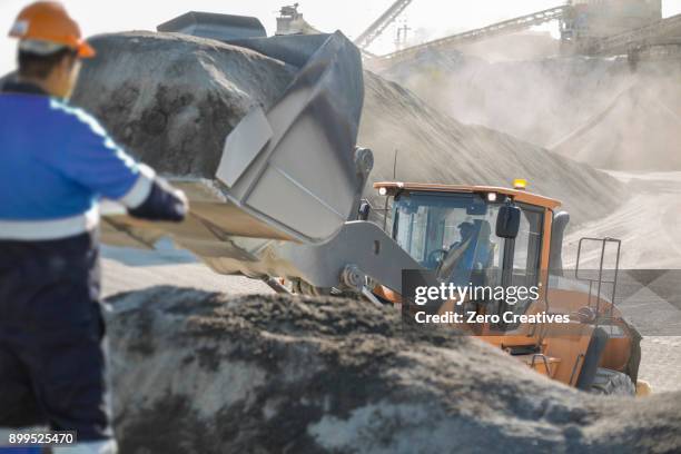 quarry worker using heavy machinery in quarry - aggregate transport stock pictures, royalty-free photos & images