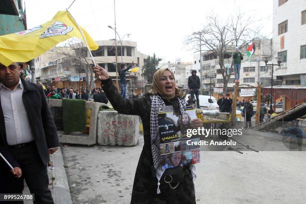 People attend a demonstration against the U.S. President Donald Trumps recognition of Jerusalem as Israels capital in Hebron, West Bank on December...