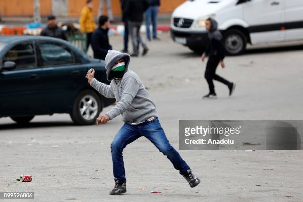 Palestinian protestors are seen during a clash with Israeli security forces as they protest against the U.S. President Donald Trumps recognition of...