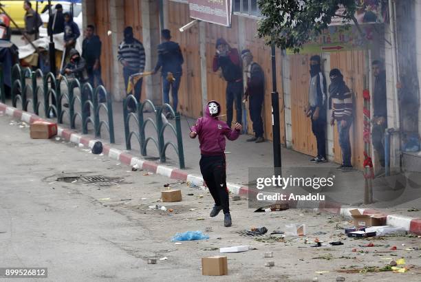 Palestinian protestors are seen during a clash with Israeli security forces as they protest against the U.S. President Donald Trumps recognition of...