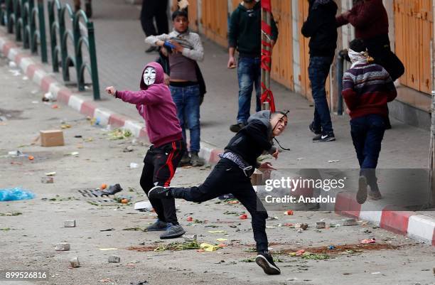 Palestinian protestors are seen during a clash with Israeli security forces as they protest against the U.S. President Donald Trumps recognition of...