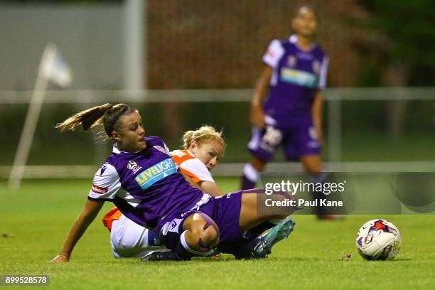 Natasha Rigby of the Perth Glory and Clare Polkinghorne of the Roar contest for the ball during the round nine W-League match between the Perth Glory...