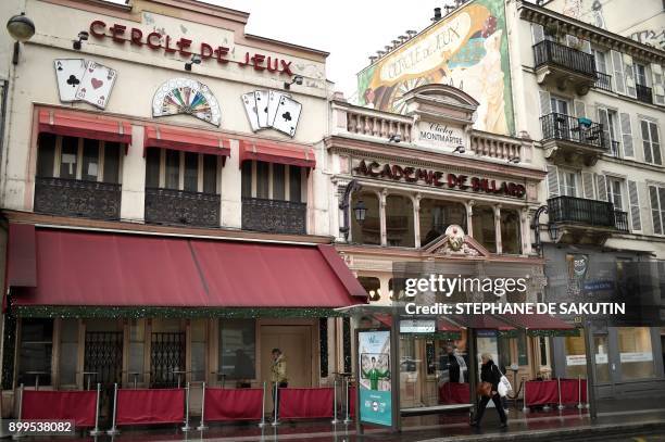 This picture taken on December 29, 2017 shows the facades of the 'Cercle de Jeux' and the 'Academie de billard' gambling clubs in Paris. - From...