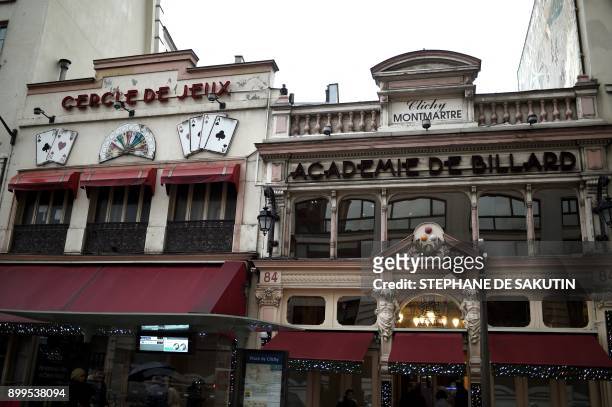 This picture taken on December 29, 2017 shows the facades of the 'Cercle de Jeux' and the 'Academie de billard' gambling clubs in Paris. - From...