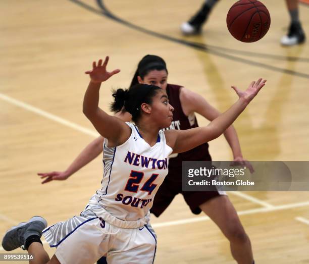 Newton South Frankie Silva leaps in front of Belmont High Greta Propp in an attempt to intercept a first quarter pass during the girls championship...