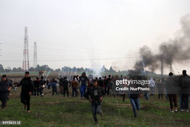 Palestinian protesters clash with Israeli soldiers near the border fence east of Gaza City on December 29, 2017.