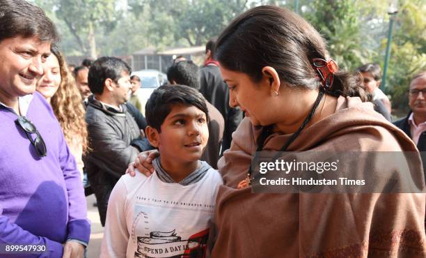 Union Minister for Information and Broadcasting Smriti Irani talking with a visitor during the on-going Winter Session of Parliament on December 29,...