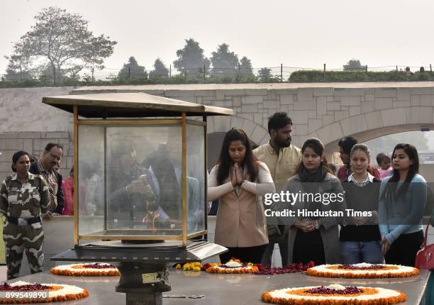 Members of Nirbhaya Jyoti trust pray to the Soul of Nirbhaya, the victim of a fatal gang-rape at Rajghat on December 29, 2017 in New Delhi, India....