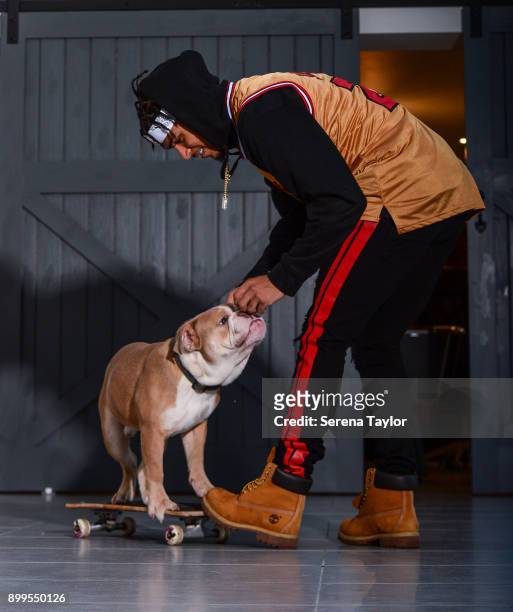 DeAndre Yedlin poses for photos with his English Bulldog, Simba during a photo shoot in Jesmond on November 30 in Newcastle upon Tyne, England.