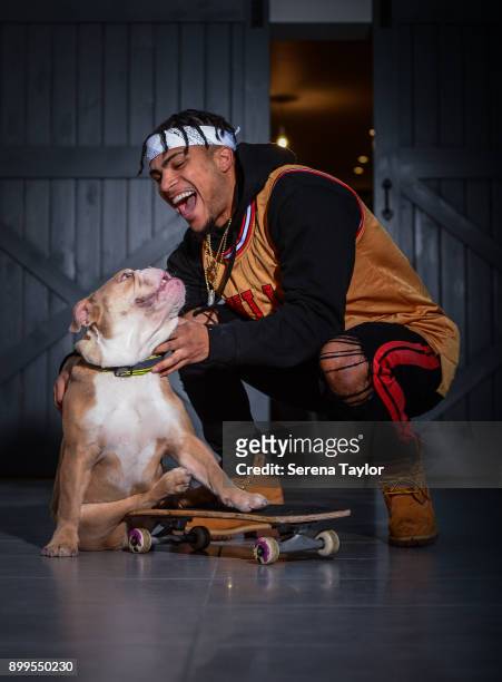 DeAndre Yedlin poses for photos with his English Bulldog, Simba during a photo shoot in Jesmond on November 30 in Newcastle upon Tyne, England.