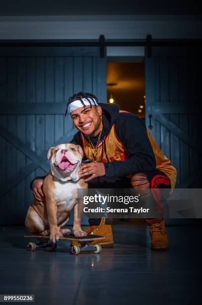 DeAndre Yedlin poses for photos with his English Bulldog, Simba during a photo shoot in Jesmond on November 30 in Newcastle upon Tyne, England.