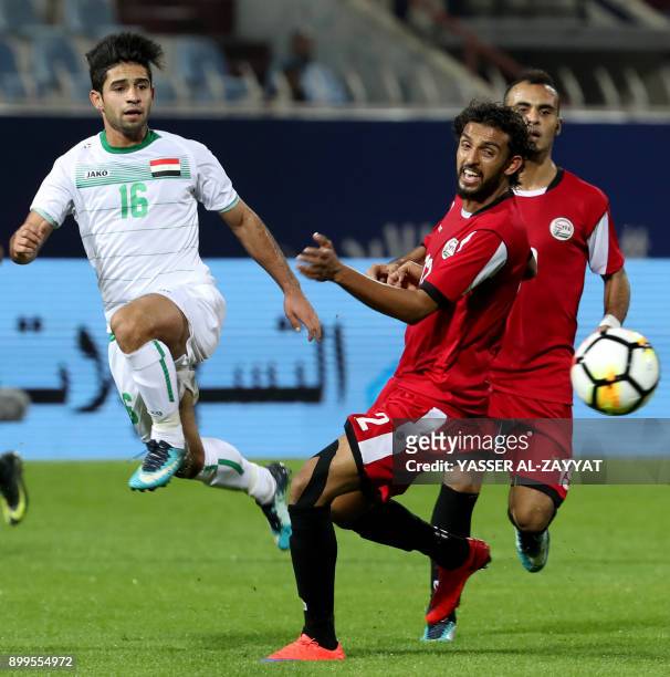Iraq's midfielder Hussein Ali vies for the ball against Yemen's midfielder Abdulwasea Al-Matari during their 2017 Gulf Cup of Nations group match at...