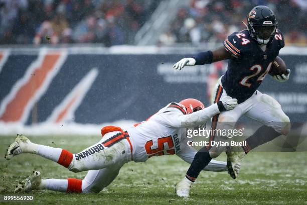 James Burgess Jr. #52 of the Cleveland Browns tackles Jordan Howard of the Chicago Bears in the third quarter at Solider Field on December 24, 2017...