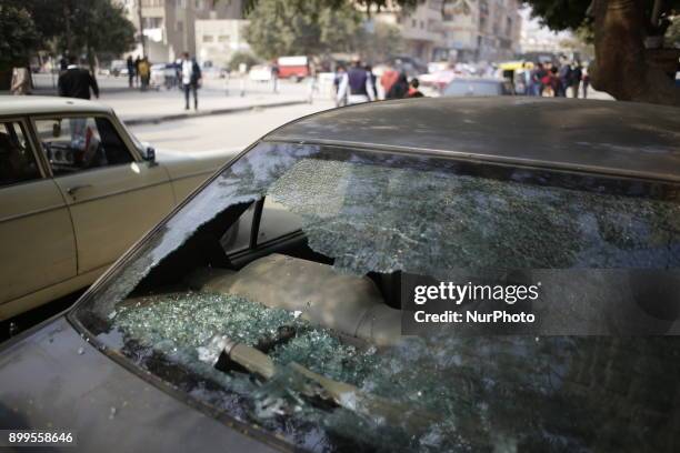 Damaged car close to the Mar Mina church is pictured after a gun attack on the church in Helwan, Southeastern Cairo, Egypt, 29 December 2017. At...