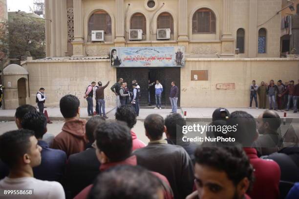 People gather outside the Mar Mina church, following a gun attack on the church in Helwan, Southeastern Cairo, Egypt, 29 December 2017. At least nine...