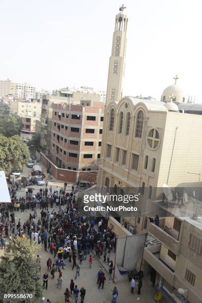 People gather outside the Mar Mina church, following a gun attack on the church in Helwan, Southeastern Cairo, Egypt, 29 December 2017. At least nine...