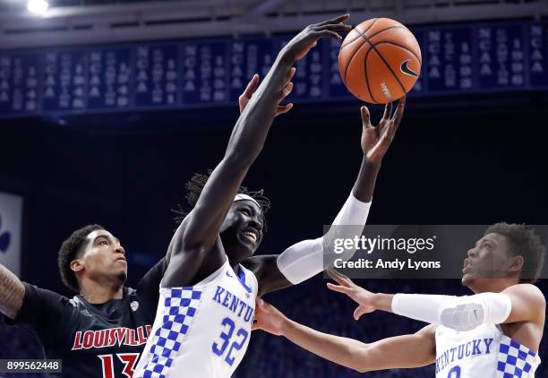 Wenyen Gabriel of the Kentucky Wildcats grabs a rebound against the Louisville Cardinals during the game at Rupp Arena on December 29, 2017 in...