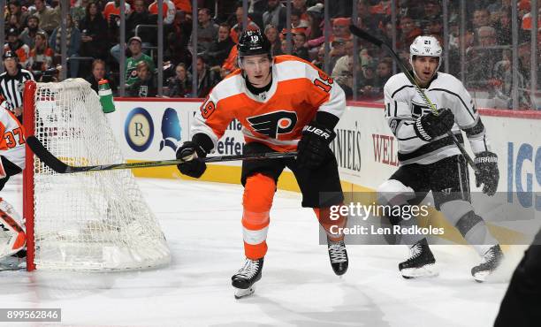 Nolan Patrick of the Philadelphia Flyers in action against Nick Shore of the Los Angeles Kings on December 18, 2017 at the Wells Fargo Center in...