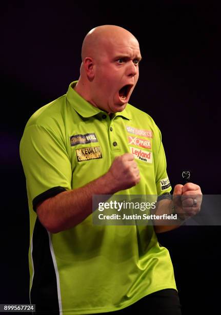 Michael Van Gerwen celebrates winning the first set during his Quarter Final Match against Raymond Van Barneveld during the 2018 William Hill PDC...