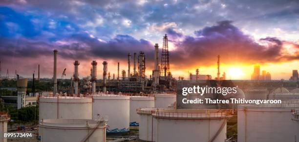 oil and gas industry - refinery factory - petrochemical plant at sunset - gas plant sunset stock-fotos und bilder