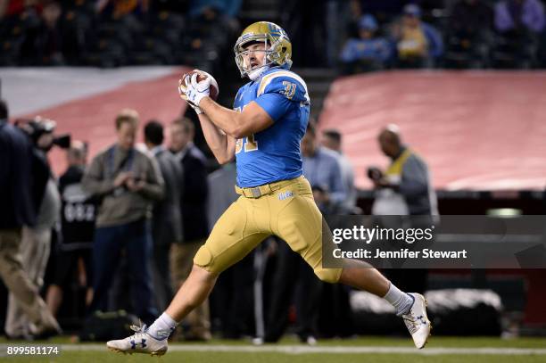 Wide receiver Will McClure of the UCLA Bruins warms up prior to the Cactus Bowl against Kansas State Wildcats at Chase Field on December 26, 2017 in...